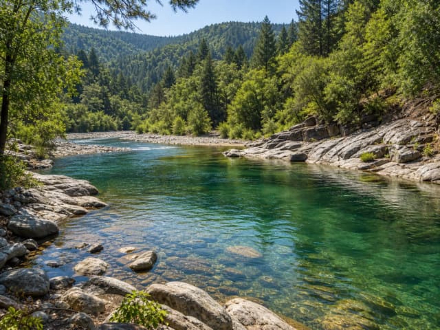Editorial image of a rocky river bend with clear natural swimming water