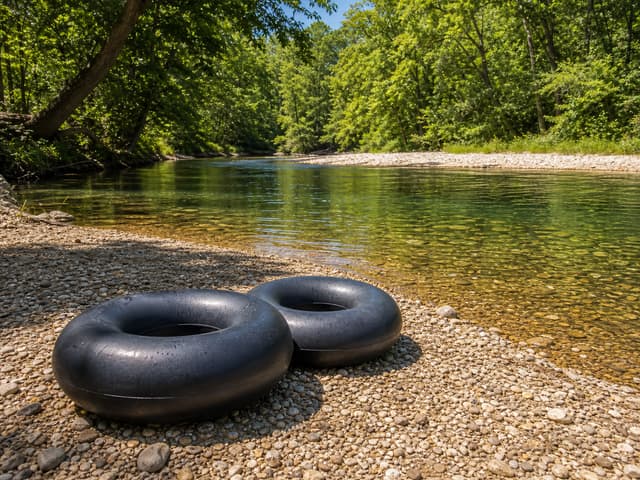 Editorial image of snorkel gear beside a crystal-clear spring