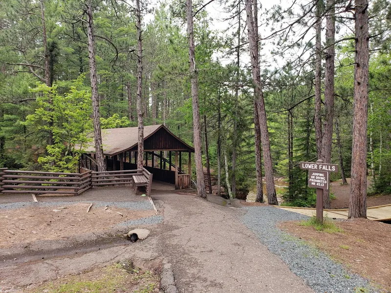 Covered bridge approach and Lower Falls sign prohibiting jumping or diving at Amnicon Falls State Park