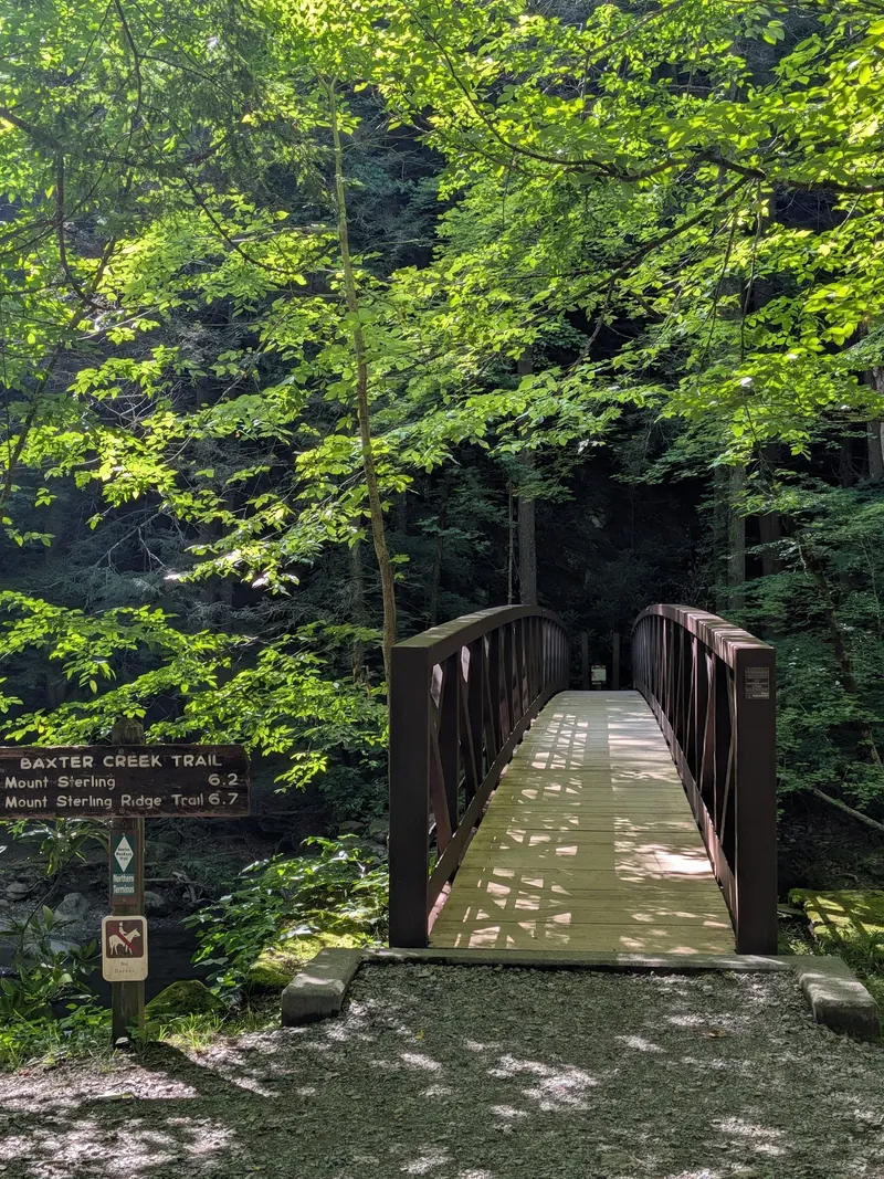 Empty bridge beside a Baxter Creek Trail sign in the Big Creek area, not the Big Creek Trail route to Midnight Hole