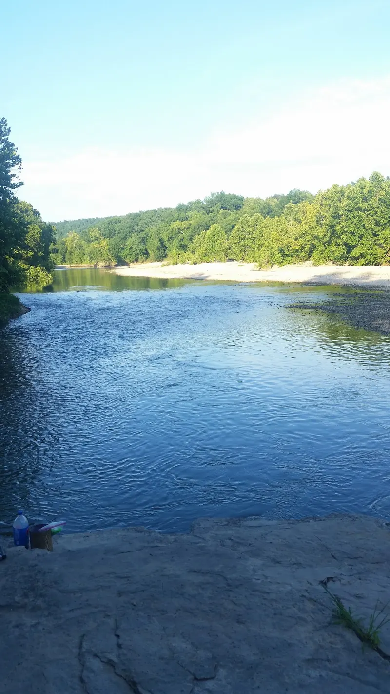 Creek bend and broad gravel bank below wooded slopes in the Boy Scout Hole photo collection