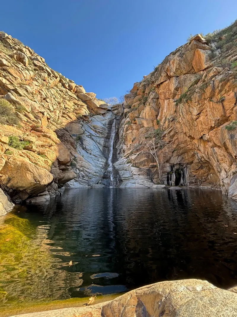 Cedar Creek waterfall dropping into a rock-lined canyon pool