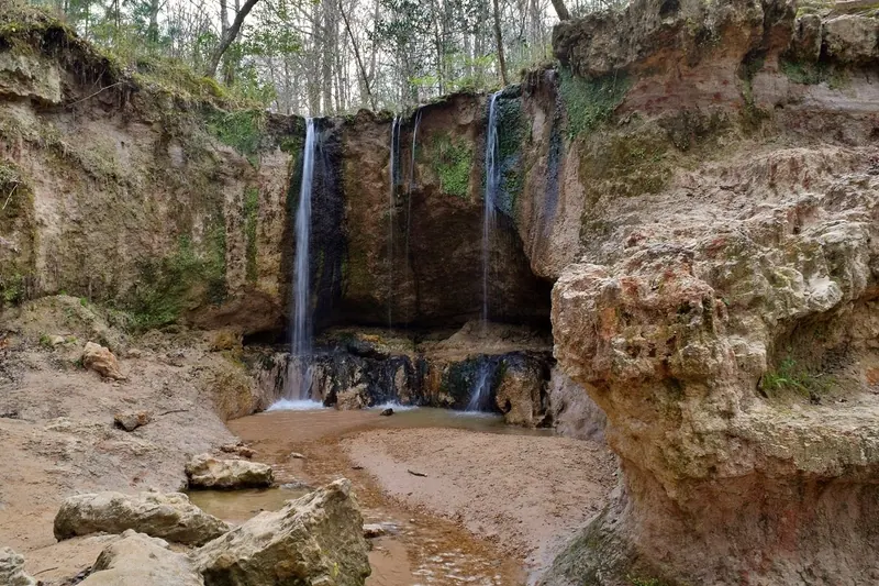 Waterfalls descending into a rocky ravine at Clark Creek Natural Area