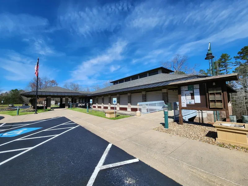 Cossatot River State Park visitor center with paved approach and information board; Highway 278 visitor services, not Brushy Creek swimming access
