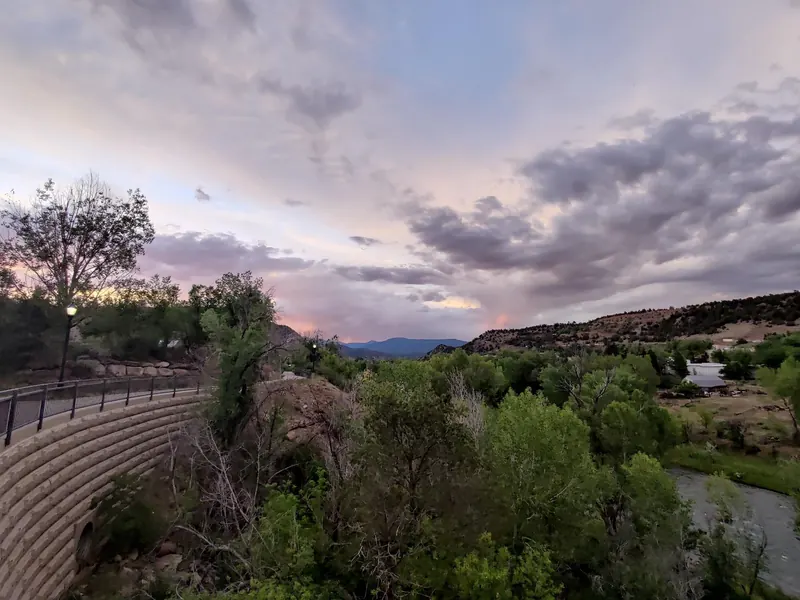 Riverside path above water in a reviewed Durango evening photograph, not a verified swimming entrance