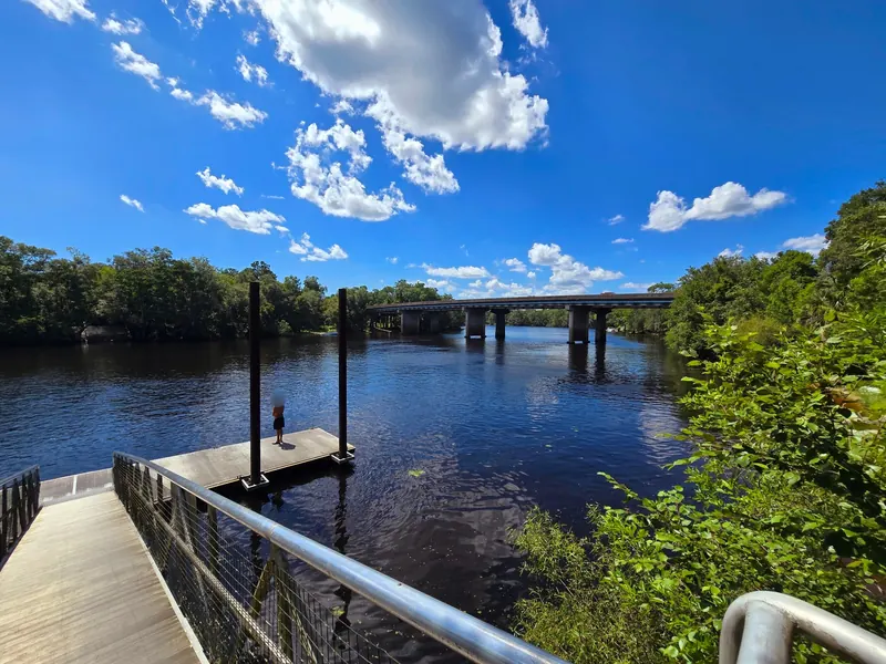 River dock and bridge viewed from the boardwalk at Fanning Springs State Park