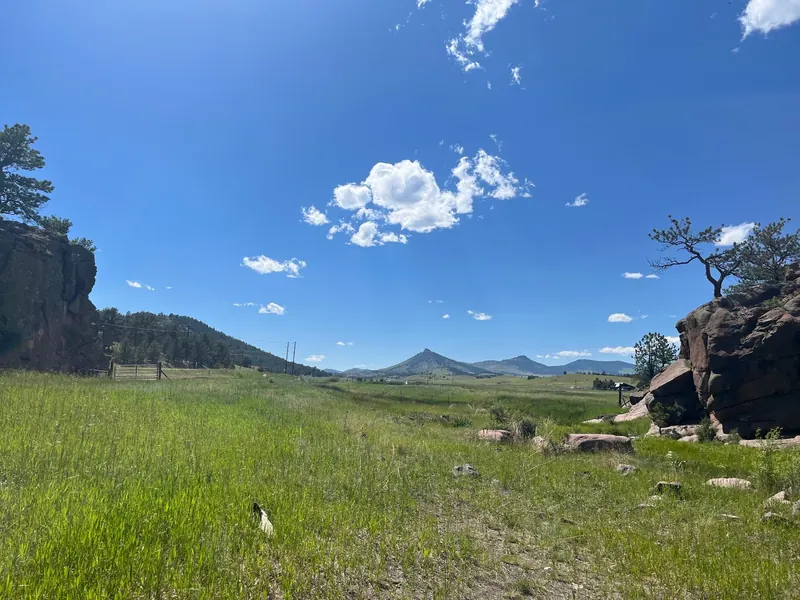 Grassy meadow between rock outcrops in the Guffey Gorge photo collection; historical scenery, not a verified trail or swimming entrance