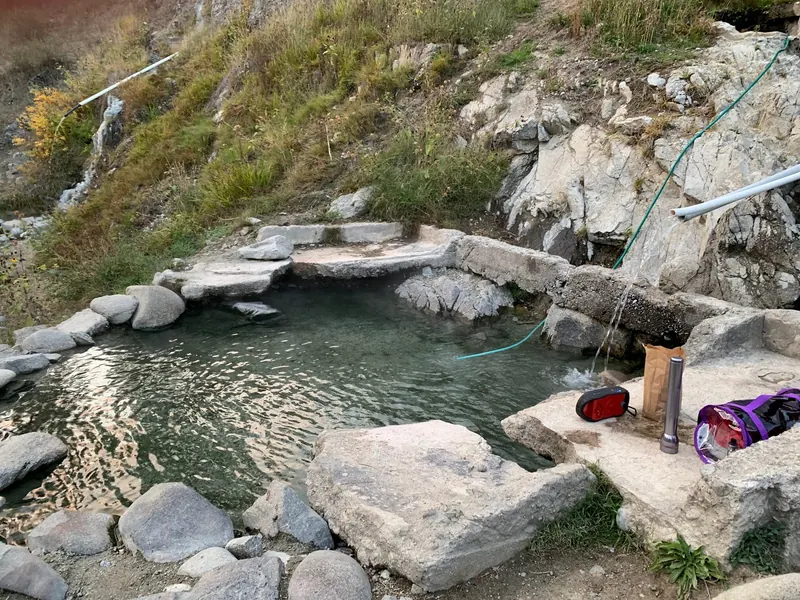 Rock-edged soaking pool and water pipes in the Hot Springs Campground photo collection