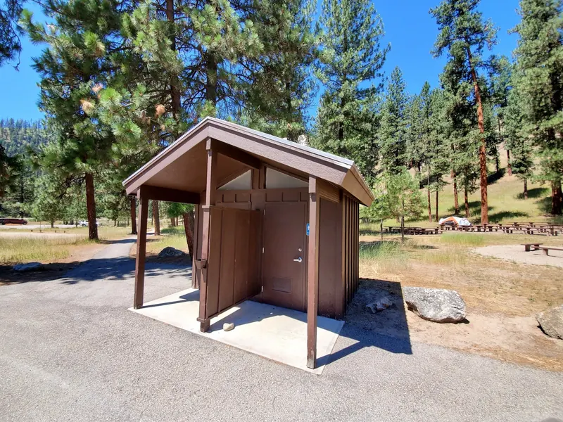 Restroom building beside a paved path at Hot Springs Campground near Garden Valley