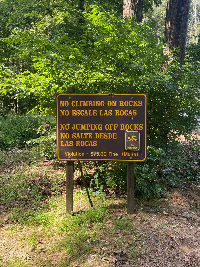 Sign at Indian Well prohibiting swimming, climbing on rocks, and jumping off rocks