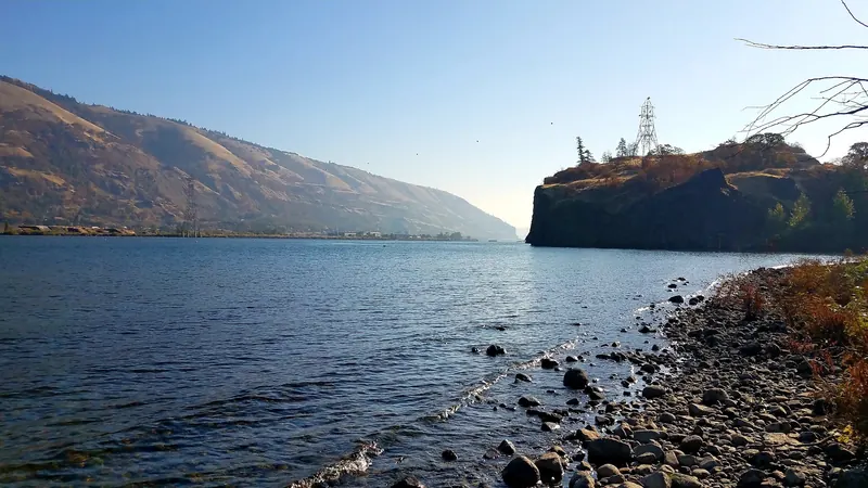Rocky riverbank and basalt outcrop beside Columbia River water in the Koberg photo collection