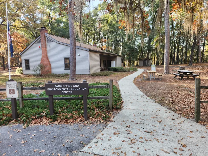 Lee State Park office and environmental education center beside picnic tables and a concrete walkway