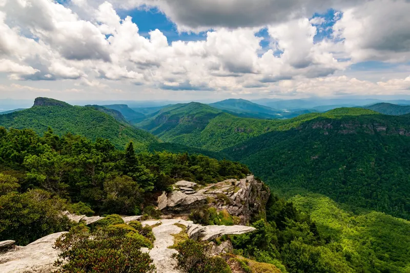 Rocky foreground overlooking the forested ridges of the Linville Gorge area
