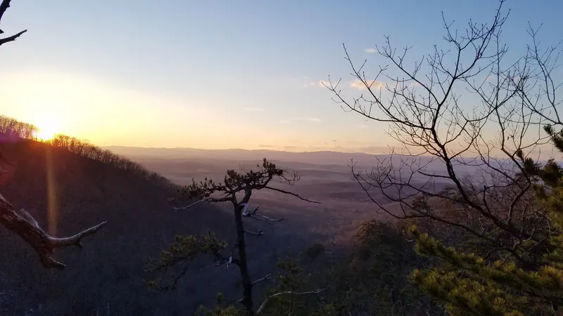 Sunset over wooded ridges in the Mountain Run photo collection, not the short waterfall approach