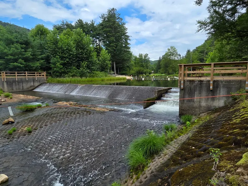Dam spillway, barriers and distant roped water area in the Ole Bull State Park collection