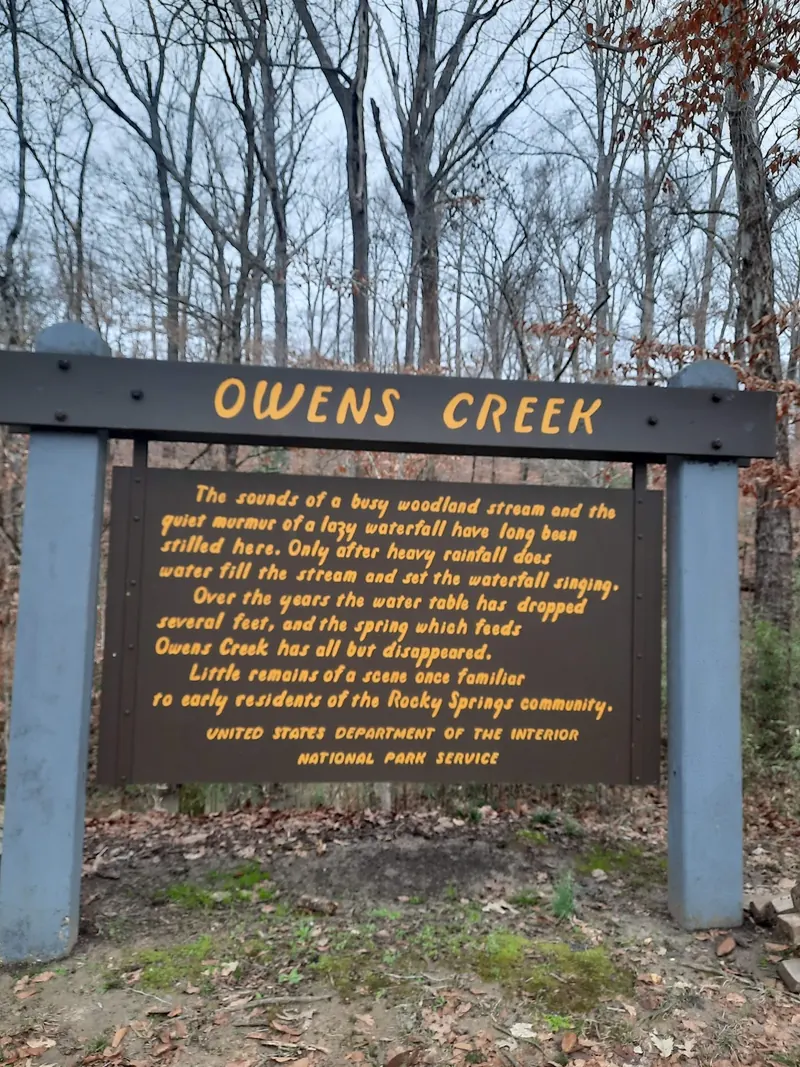 NPS Owens Creek interpretive sign explaining reduced spring flow and rainfall-dependent water