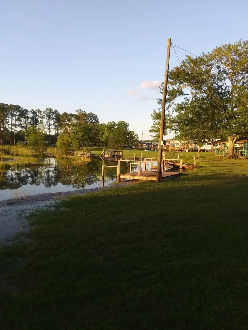 Waterside wooden decks, grassy banks and campers in the historical Presley's Outing collection