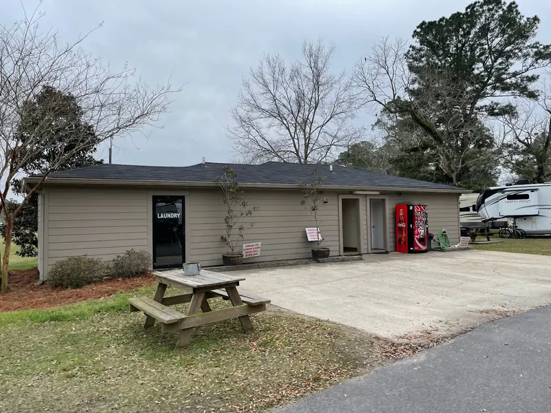 Laundry and bathhouse exterior with picnic table in the saved Presley's Outing campground collection
