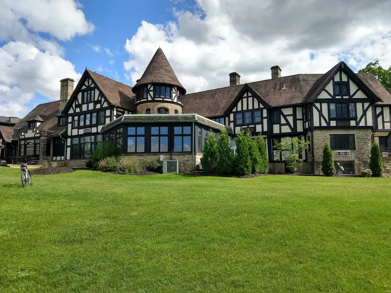 Tudor-style Punderson Manor lodge and lawn, separate from the lake swimming beach