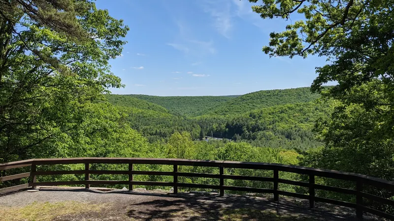 Empty fenced overlook facing forested ridges in the R.B. Winter park-area photo collection