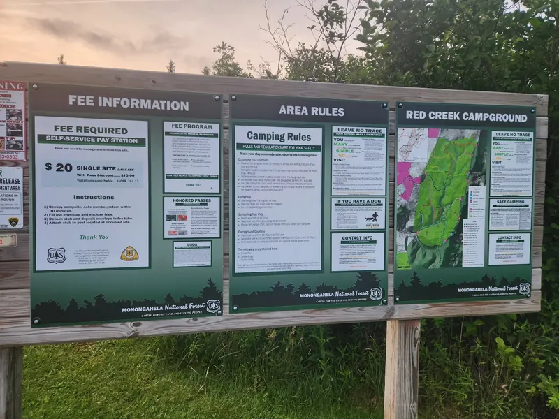 Red Creek Campground information board with map, rules and historical fee notice; check current notices rather than relying on photographed prices