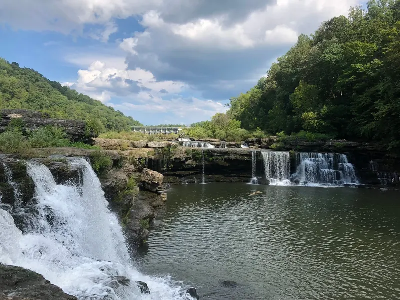 Rock ledges and cascades below the dam at Rock Island State Park; gorge access depends on dam operations
