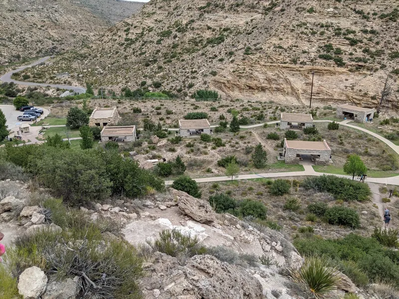 Stone picnic shelters, paved paths and parking in the Sitting Bull Falls recreation-area collection