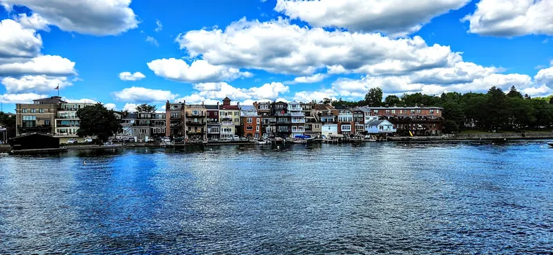 Summer view across Skaneateles Lake toward village waterfront buildings