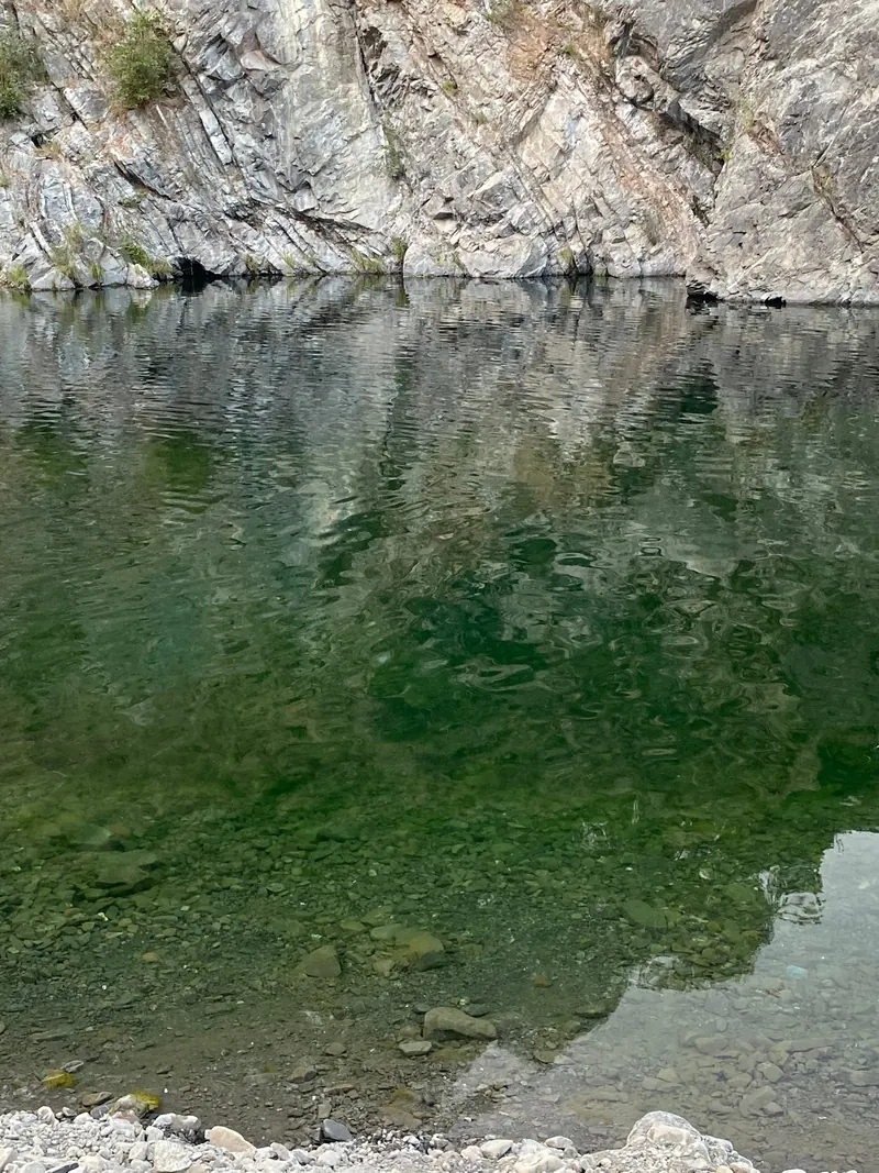 River water beside a rock wall in the Standish-Hickey park collection