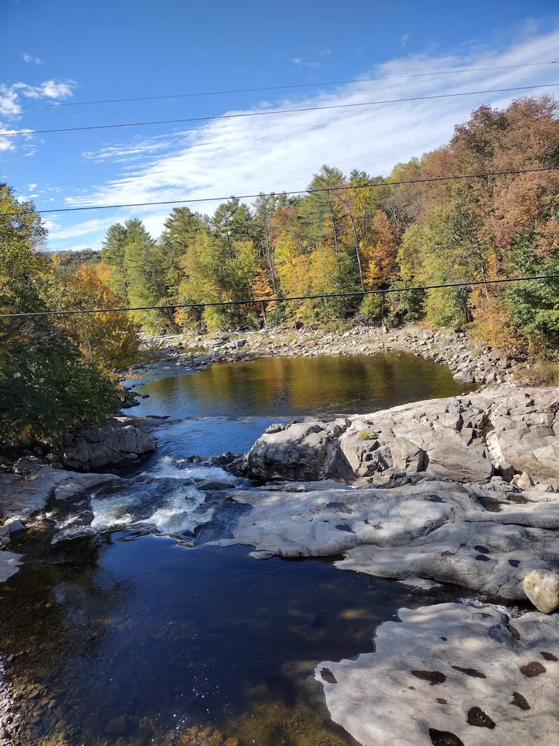 Rock-edged Wild Ammonoosuc River pools and autumn woodland near Swiftwater Bridge
