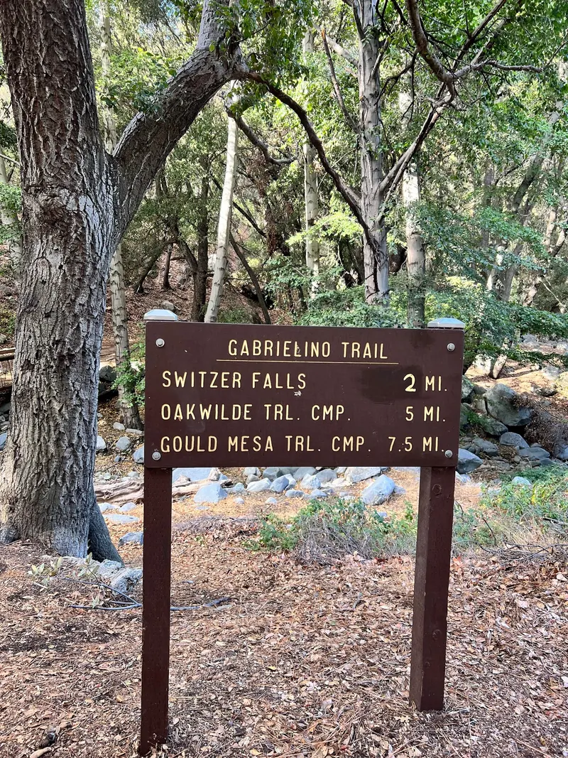 Gabrielino Trail sign naming Switzer Falls and onward trail camps