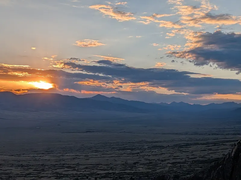 Sunset sky above the broad valley seen from Valley View Hot Springs