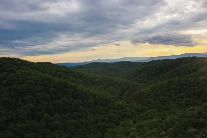 Forested ridges beneath clouds and evening light in the Watoga State Park photo collection, shown as regional landscape context