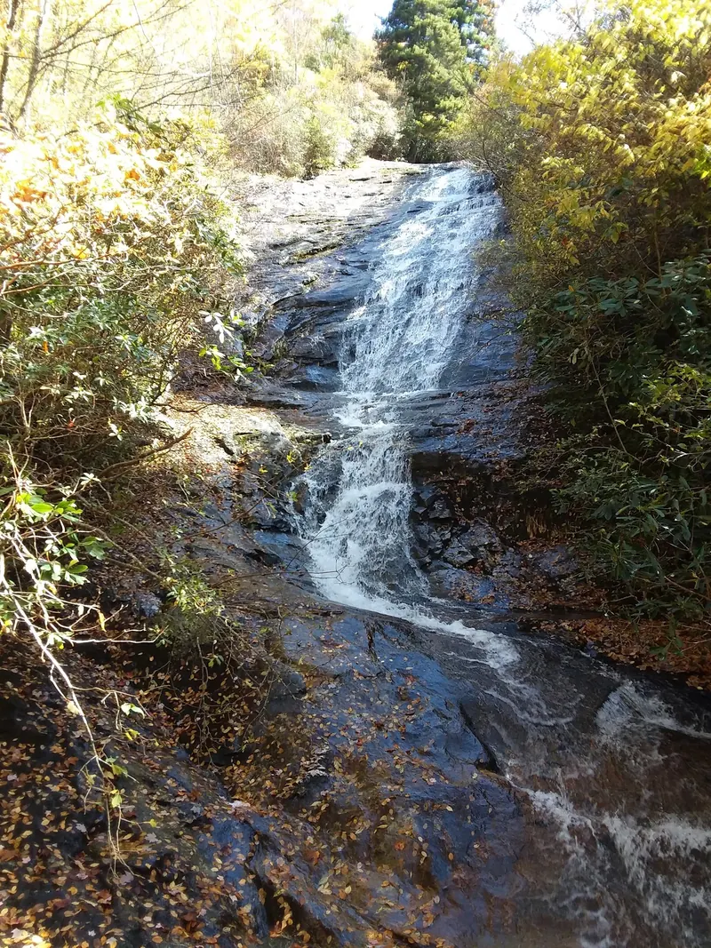 Wildcat Falls rock cascade bordered by autumn leaves